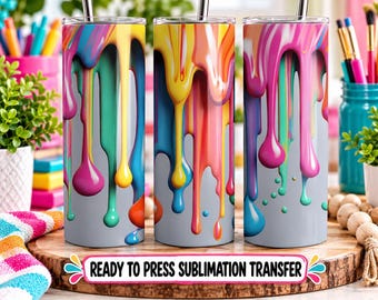 May include: Three cylindrical tumblers featuring a vibrant design of multi-colored paint drips in shades of pink, yellow, blue, orange, and teal against a light gray background. Each tumbler includes a thin metal straw inserted at the top.