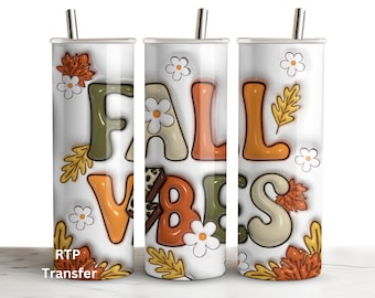 May include: Three white tumblers with a fall-themed design. The tumblers feature the words "Fall Vibes" in orange, brown, and cream colors with fall leaves and flowers.