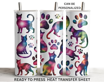 May include: White tumbler featuring colorful cat silhouettes and paw prints with a galaxy design. The text "CAN BE PERSONALIZED" and "READY TO PRESS HEAT TRANSFER SHEET" are printed on the tumbler.