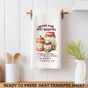 May include: White kitchen towel with the text "RECIPE FOR BEST GRANDMA" and a watercolor illustration of jars filled with ingredients. The recipe includes "2 cups of warm hugs" and "A whole lot of Love."