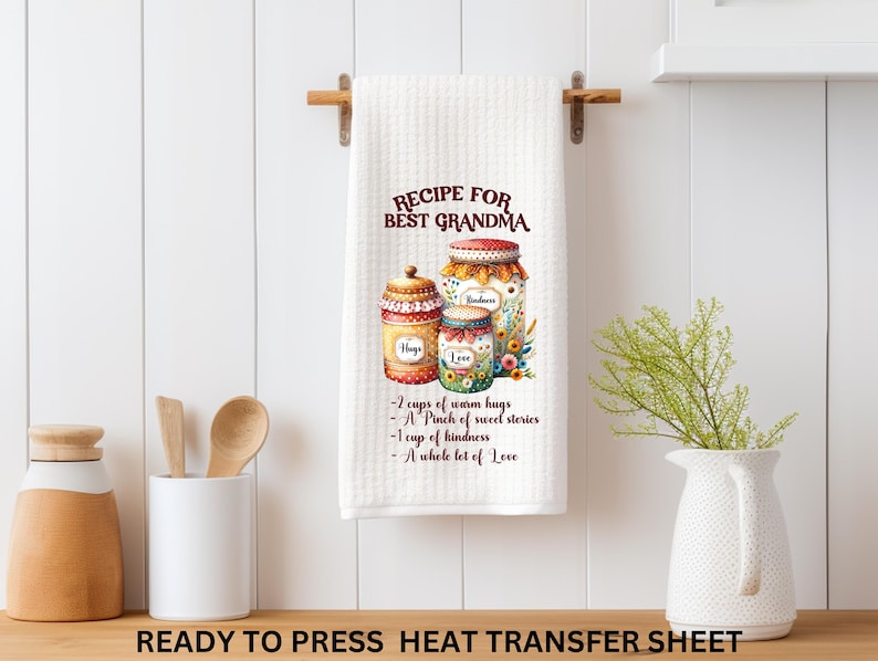 May include: White kitchen towel with the text "RECIPE FOR BEST GRANDMA" and a watercolor illustration of jars filled with ingredients. The recipe includes "2 cups of warm hugs" and "A whole lot of Love."