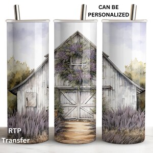 May include: A white barn with a purple flower wreath on the door, surrounded by lavender plants. The barn is against a watercolor background of a blue sky and green trees. The image is on a stainless steel tumbler with a straw.
