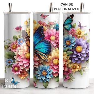 May include: A white stainless steel tumbler with a colorful floral design featuring butterflies. The tumbler has a straw and is ready to be personalized.