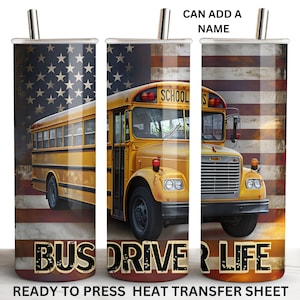 May include: A yellow school bus with the words "SCHOOL BUS" on the side is driving down a road with an American flag background. The text "BUS DRIVE LIFE" is at the bottom of the image.