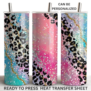 May include: Three stainless steel tumblers with a pink, blue, and purple glitter background and a black leopard print design. The tumblers are ready to be personalized. "Can be personalized" and "Ready to press heat transfer sheet" are written on the image.