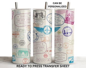 May include: Three stainless steel tumblers with a white background and colorful travel stamp designs. The tumblers feature various city names and dates, including London, Paris, Hong Kong, Moscow, and Tokyo. The text "CAN BE PERSONALIZED" is at the top of the image.