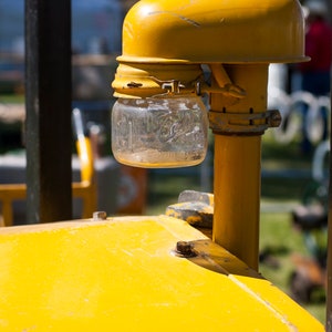 Yellow Tractor with a Ball Jar Light Printed on Canvas 12 x 16