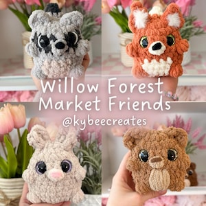 May include: Four handmade crochet animal plushies: a raccoon, fox, bunny, and bear. The raccoon is gray and black, the fox is orange and white, the bunny is beige, and the bear is brown. The text "Willow Forest Market Friends" and the creator's handle are also visible.