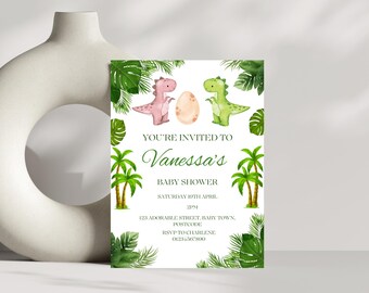 May include: A baby shower invitation with a green, pink, and white color scheme. The invitation features a pink dinosaur and a green dinosaur holding a white egg. The text on the invitation reads "You're invited to Vanessa's Baby Shower".