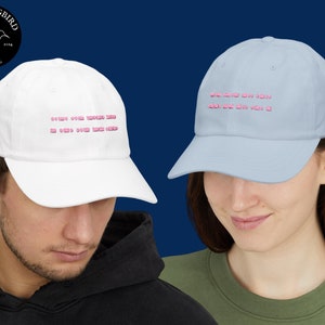 May include: Two baseball caps with pink text. The white cap says "SO MUCH OVER THINKING SO MUCH OVER THINKING". The light blue cap says "ONE DAY YOU WILL LOOK BACK AND SAY WOW I DID THAT".