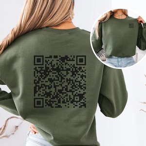 May include: A green sweatshirt with a black QR code printed on the back. The sweatshirt has long sleeves and a crew neck.