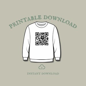 May include: White sweatshirt featuring a black QR code design. The text "PRINTABLE DOWNLOAD" arches above the sweatshirt, with "INSTANT DOWNLOAD" below. A cloud graphic is also included in the design.