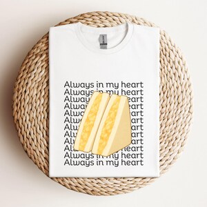 White t-shirt with illustrated Japanese egg sandwich and matching Japanese script, displayed flat on neutral background