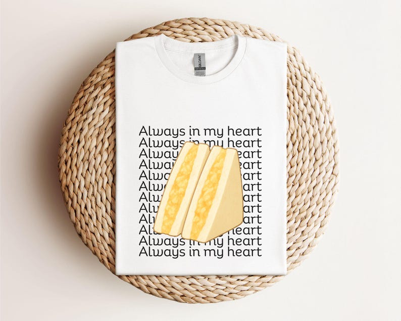 White t-shirt with illustrated Japanese egg sandwich and matching Japanese script, displayed flat on neutral background