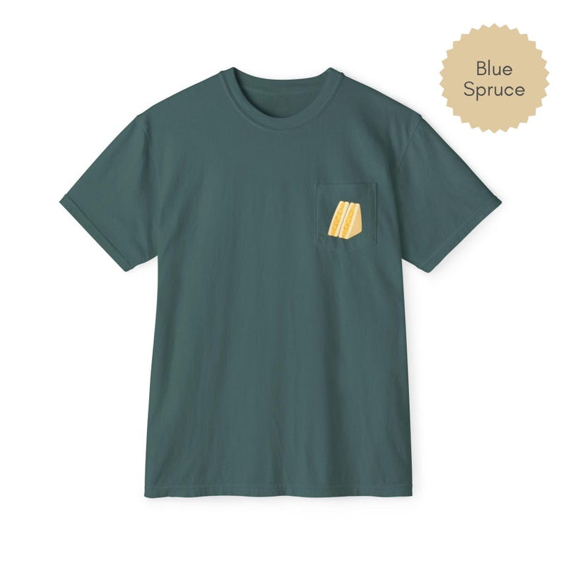 Tamago sando pocket t shirt in blue spruce with egg sandwich print on chest pocket
