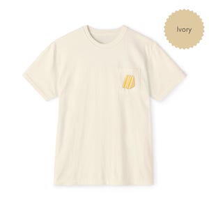 Tamago sando pocket t shirt in ivory with egg sandwich print on chest pocket