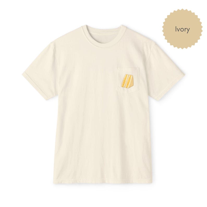 Tamago sando pocket t shirt in ivory with egg sandwich print on chest pocket