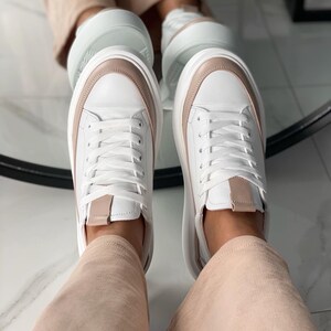 Exclusive white sneakers with beige inserts made of leather, handmade, unique genuine design, fashionable, comfortable, and stylish footwear