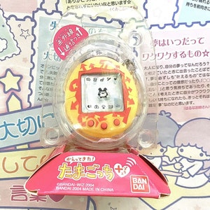 Tamagotchi Connection V1 Plus: Amarillo con flechas (NUEVO)