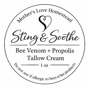 May include: A circular label with the text "Mother's Love Homestead" and "Sting & Soothe". The label also includes "Bee Venom + Propolis Tallow Cream" and "1 oz". The text "Do not use if allergic to bees or bee products" is also present.