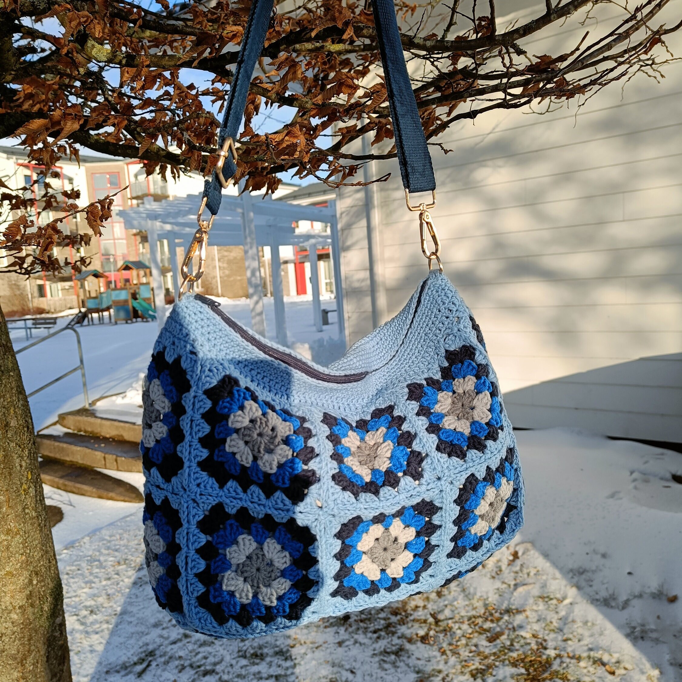 Light blue granny square handmade chic crochet clutch and crossoverbag. 2 in one bag. All day toiletry pouch and cosmetic bag