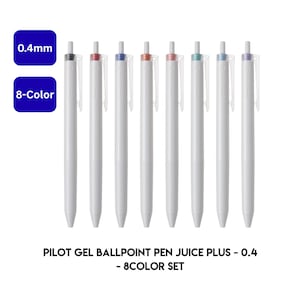 May include: A set of eight Pilot Juice Plus gel pens with white barrels and retractable clips. Each pen features a different colored ink indicator on the top plunger, including black, red, blue, orange, pink, green, light blue, and purple. Text reads 0.4mm, 8-Color, and PILOT GEL BALLPOINT PEN JUICE PLUS - 0.4 - 8COLOR SET.
