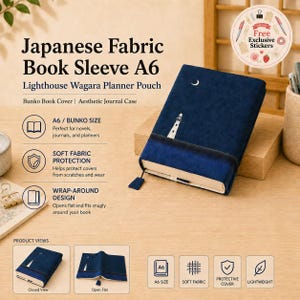May include: A dark blue A6 fabric book sleeve featuring an embroidered white lighthouse and a crescent moon. The rectangular pouch has a wrap-around design with a matching fabric strap. Two smaller inset images show the sleeve in closed and open positions.