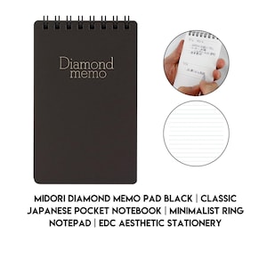 May include: A black pocket-sized memo pad with a spiral-bound top and the text "Diamond memo" printed in gold on the front cover. The interior pages are white with horizontal lines, and the notebook is shown in use with handwritten notes.