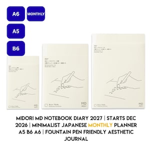 May include: Three off-white Midori MD Notebook Diary 2027 planners in A6, A5, and B6 sizes. Each cover features a line drawing of a hand writing 2027, the text MD PRODUCT, and Japanese characters. Blue icons labeled A6, A5, B6, and MONTHLY are visible.