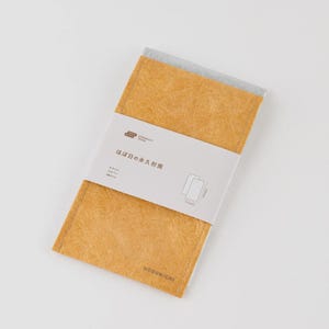 May include: Two paper envelopes, one light brown and one grey, are visible. They are held together by a white band with Japanese text and a product diagram. The envelopes measure approximately 22cm x 17cm. The brand name "HOBONICHI" is printed on the bottom.