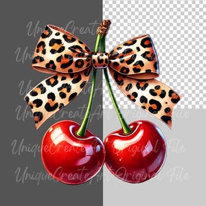 May include: Two red cherries with green stems and a brown and orange leopard print bow tied around the stems.