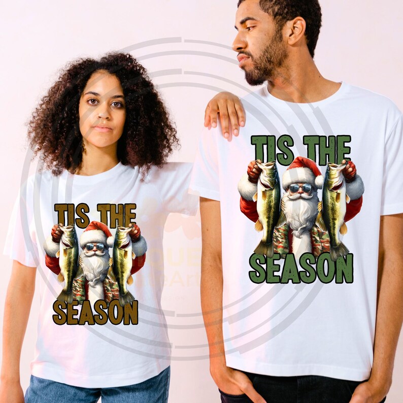 May include: White t-shirt with a graphic of Santa Claus holding two fish and the text "Tis the Season".