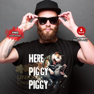 May include: Black t-shirt with a graphic of a pit bull and a boar, with the text "HERE PIGGY PIGGY" in white. The pit bull is wearing a camouflage vest. The image is a digital download.
