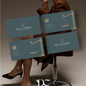 May include: Business cards with a teal background and gold accents. The cards feature the text "Mark M. William, lawyer" and a scale of justice symbol. A QR code and contact information are also included. The image has a neutral background.