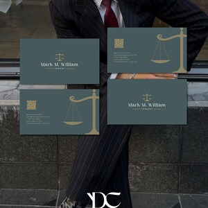 May include: Four business cards with a teal background and gold accents. The cards feature a scale of justice graphic and the name "Mark M. William, lawyer." A QR code and contact information are also included. The cards are displayed in front of a person wearing a pinstripe suit.