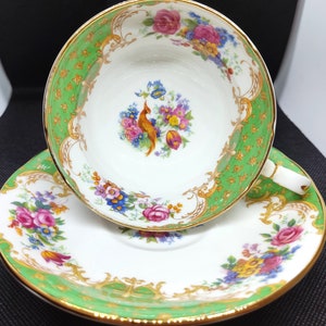 Vintage Paragon Double Warrant green &quot;Rockingham&quot; Teacup and saucer set.