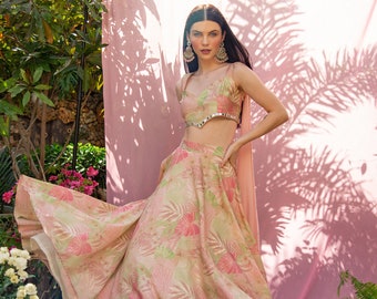 PRINTED FLORAL LEHENGA, light weight pink floral lehenga with tint of green and gold. Mirror work on the blouse and trail .