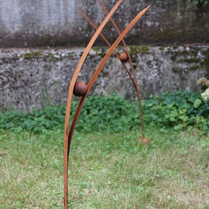 A Heron looking at the sky: garden rusty metal sculpture. Weathered steel big garden birds