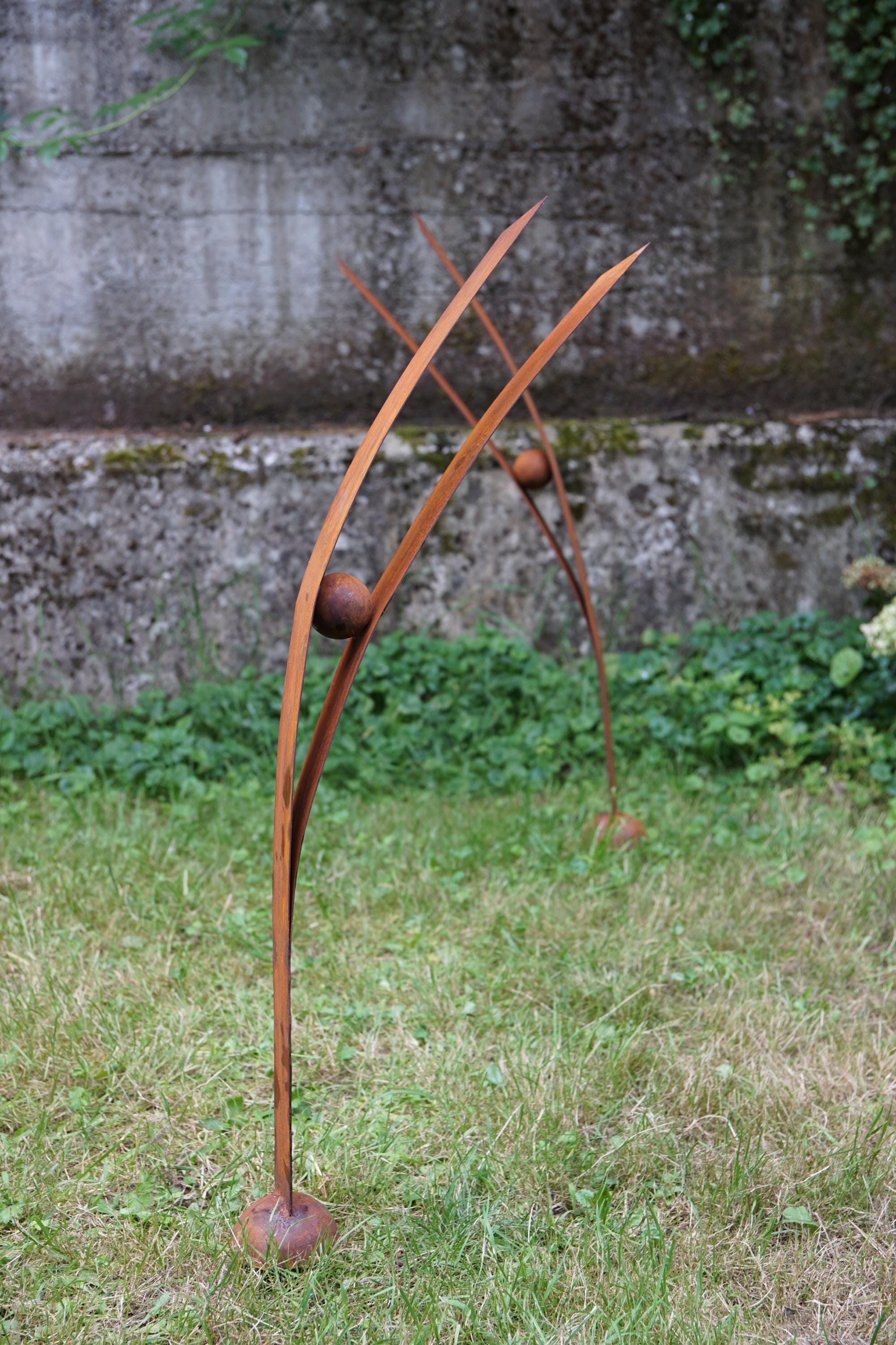 A Heron looking at the sky: garden rusty metal sculpture. Weathered steel big garden birds