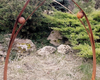 A Heron looking at the sky: garden rusty metal sculpture. Weathered steel big garden birds