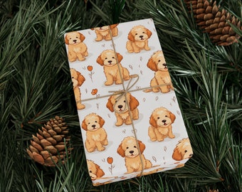 Puede incluir: Papel de regalo blanco con un patrón repetido de perros de dibujos animados marrones y blancos. Los perros están todos sentados y tienen una expresión feliz en sus caras.
