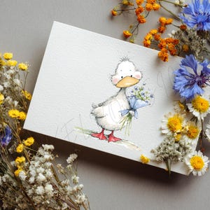May include: A watercolor illustration of a white duckling holding a bouquet of blue flowers tied with a blue ribbon. The duckling has a yellow beak and red feet. The image is on a white card, surrounded by dried flowers in yellow, orange, and blue.