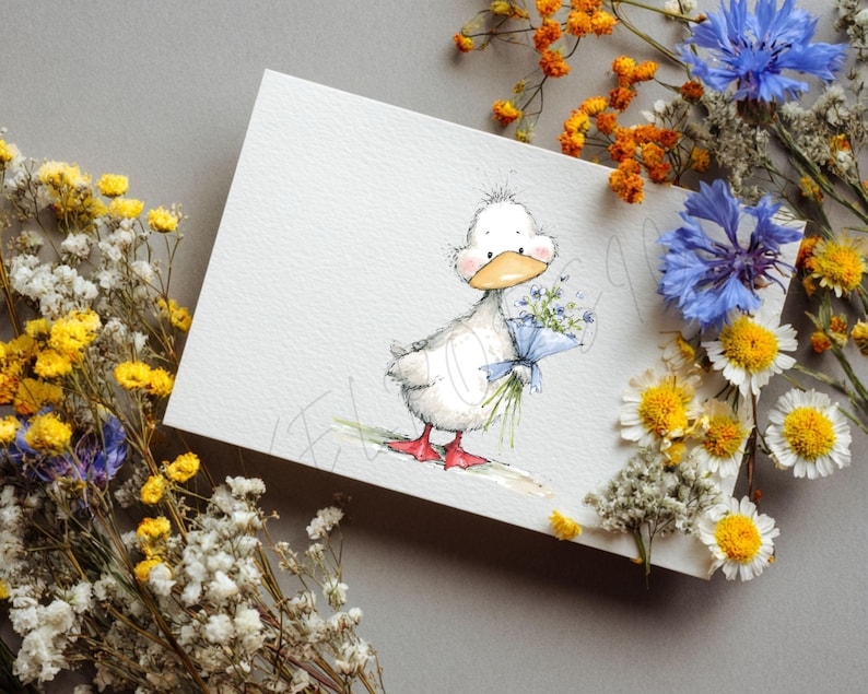 May include: A watercolor illustration of a white duckling holding a bouquet of blue flowers tied with a blue ribbon. The duckling has a yellow beak and red feet. The image is on a white card, surrounded by dried flowers in yellow, orange, and blue.