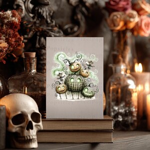 May include: A rectangular greeting card featuring a whimsical illustration of five glowing, textured pumpkins with swirling green smoke and small stick figures. The pumpkins have carved, illuminated faces and are arranged in a cluster on a light background.