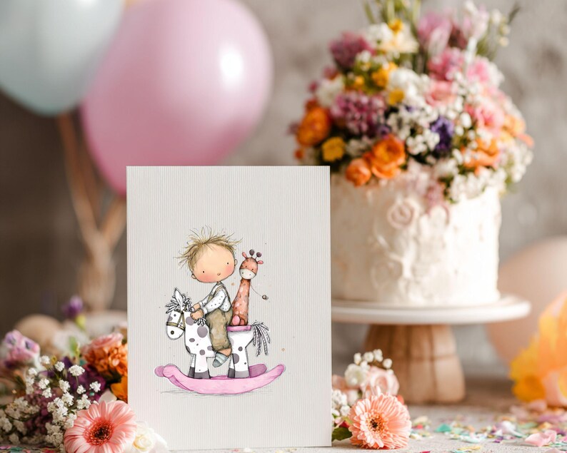May include: A greeting card featuring a watercolor illustration of a child riding a rocking horse with a giraffe. The rocking horse is white with black spots and a pink base. The card is set in front of a cake and balloons.