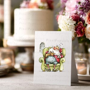 K&ouml;nnte beinhalten: Eine gefaltete Gru&szlig;karte mit einer Aquarellillustration von Santa Claus, der in einem gr&uuml;nen Sessel mit einem Rentier schl&auml;ft. Die Karte befindet sich vor einem verschwommenen Hintergrund mit Blumen und einem Kuchen, was auf ein festliches Thema hindeutet.
