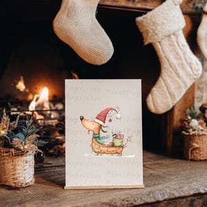 May include: A rectangular print featuring a whimsical illustration of a tan dachshund wearing a red Santa hat and a green scarf. The dog is wrapped in string lights and carries a green gift box on its back. The background is a plain light cream color.