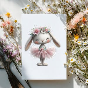 May include: A whimsical illustration of a white bunny wearing a pink tutu and a floral crown. The bunny has closed eyes and a sweet expression. The image is surrounded by delicate flowers, creating a soft and charming aesthetic.