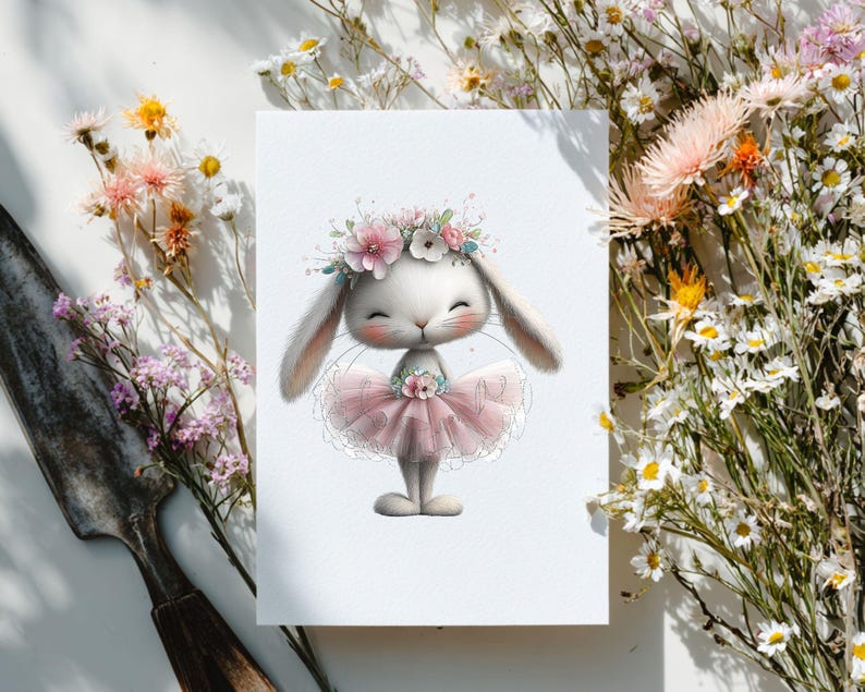 May include: A whimsical illustration of a white bunny wearing a pink tutu and a floral crown. The bunny has closed eyes and a sweet expression. The image is surrounded by delicate flowers, creating a soft and charming aesthetic.