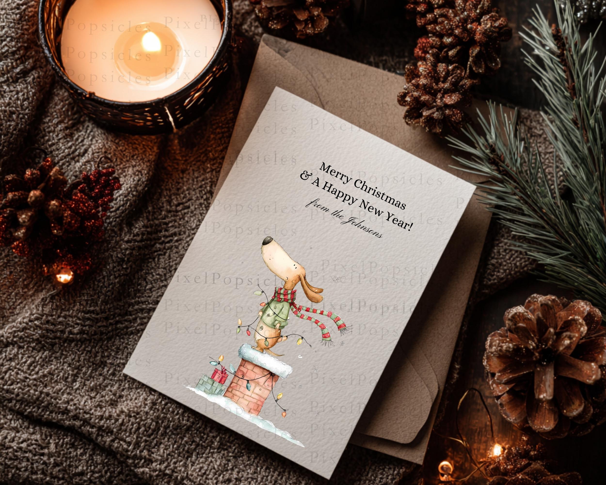 May include: A cream-colored greeting card featuring a cartoon dog wearing a green sweater and red-striped scarf, perched on a brick chimney with string lights. The text reads: Merry Christmas & A Happy New Year! from the Johnsons.